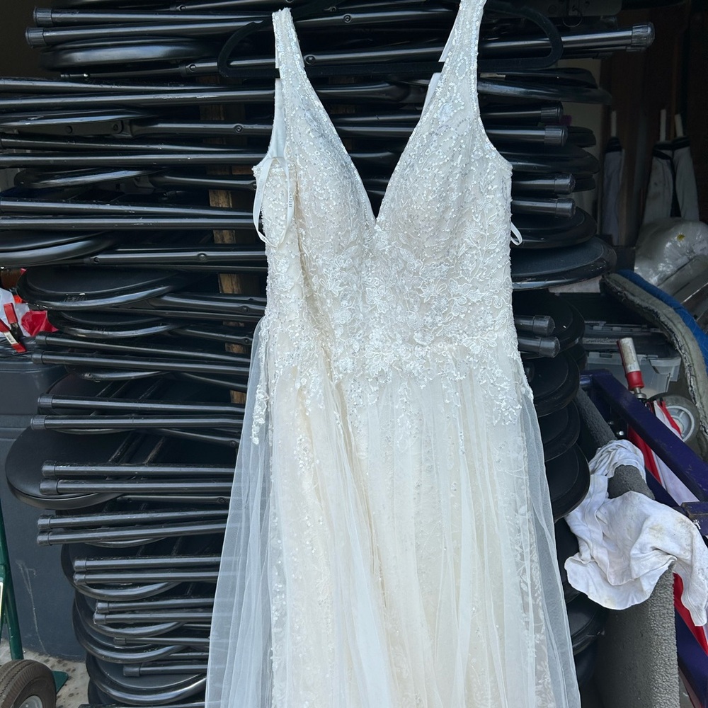 Brand new designer wedding gown. Price negotiable.
